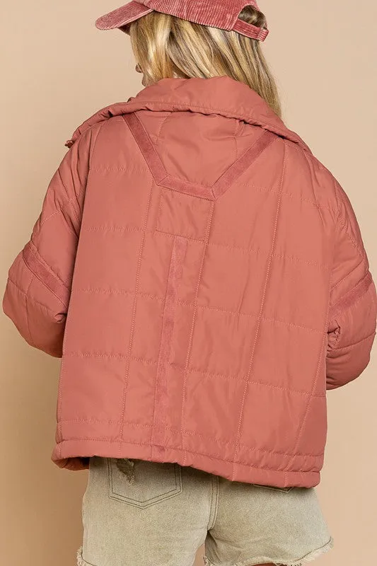 Designed in quilted jacket with zipper closure